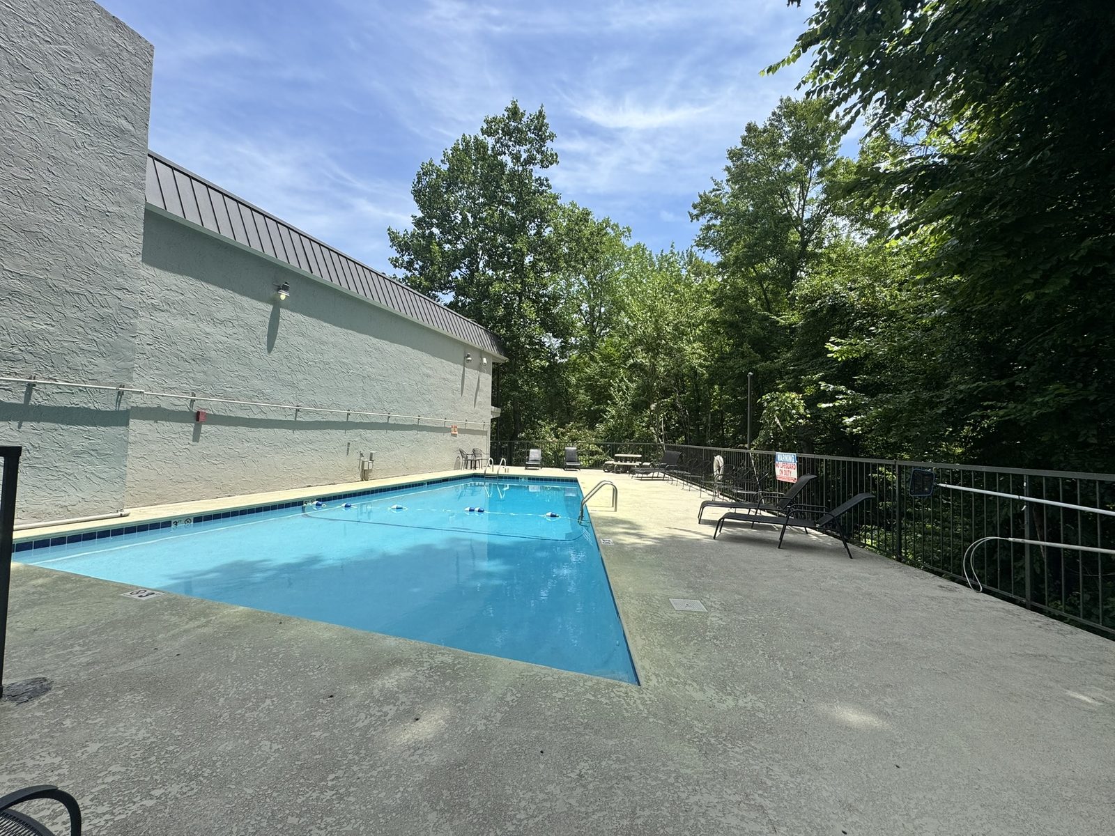 Motel 6 Gatlinburg pool area with lounge seating